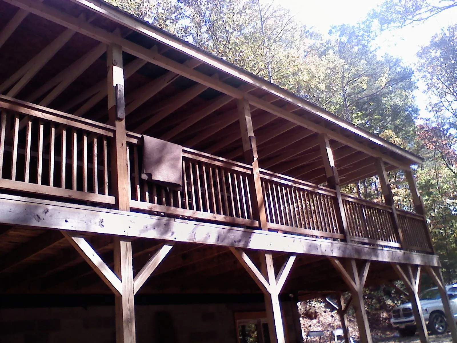 Timber framing under a new elevated porch and deck — Roof Leak Repair in Ether by Roofing Brothers